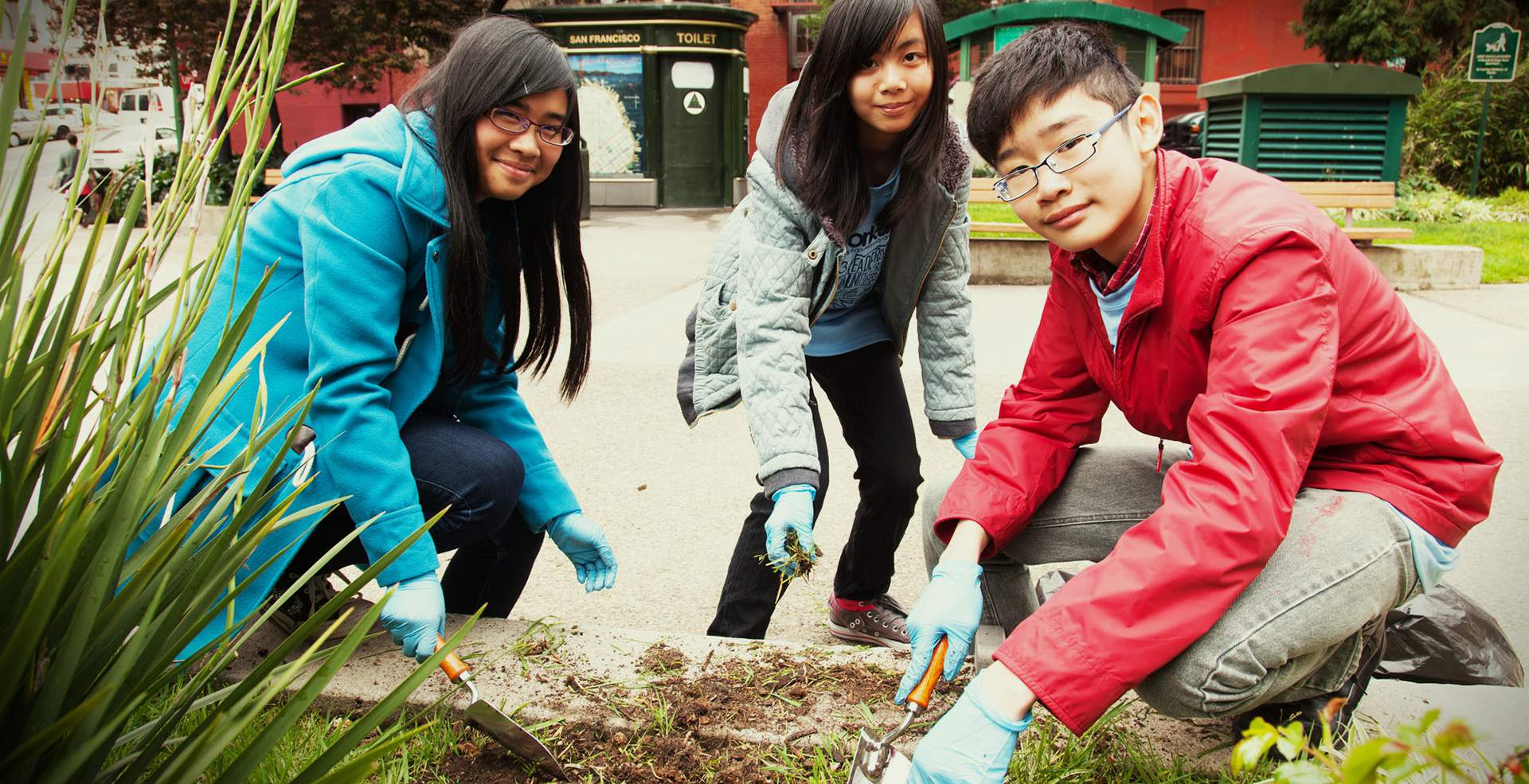 Youth gardening at St. Mary's Square. Photo by Jason Pang.